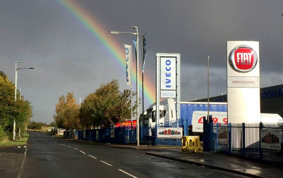 Rainbow starting over an IVECO and FIAT Dealership